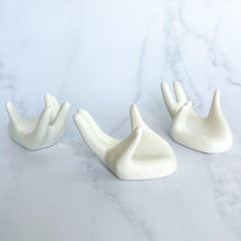 Load image into Gallery viewer, White Ceramic Sphere Holding Hands